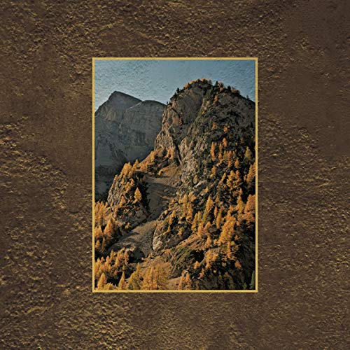 Mountain landscape with trees in autumn, framed in gold.