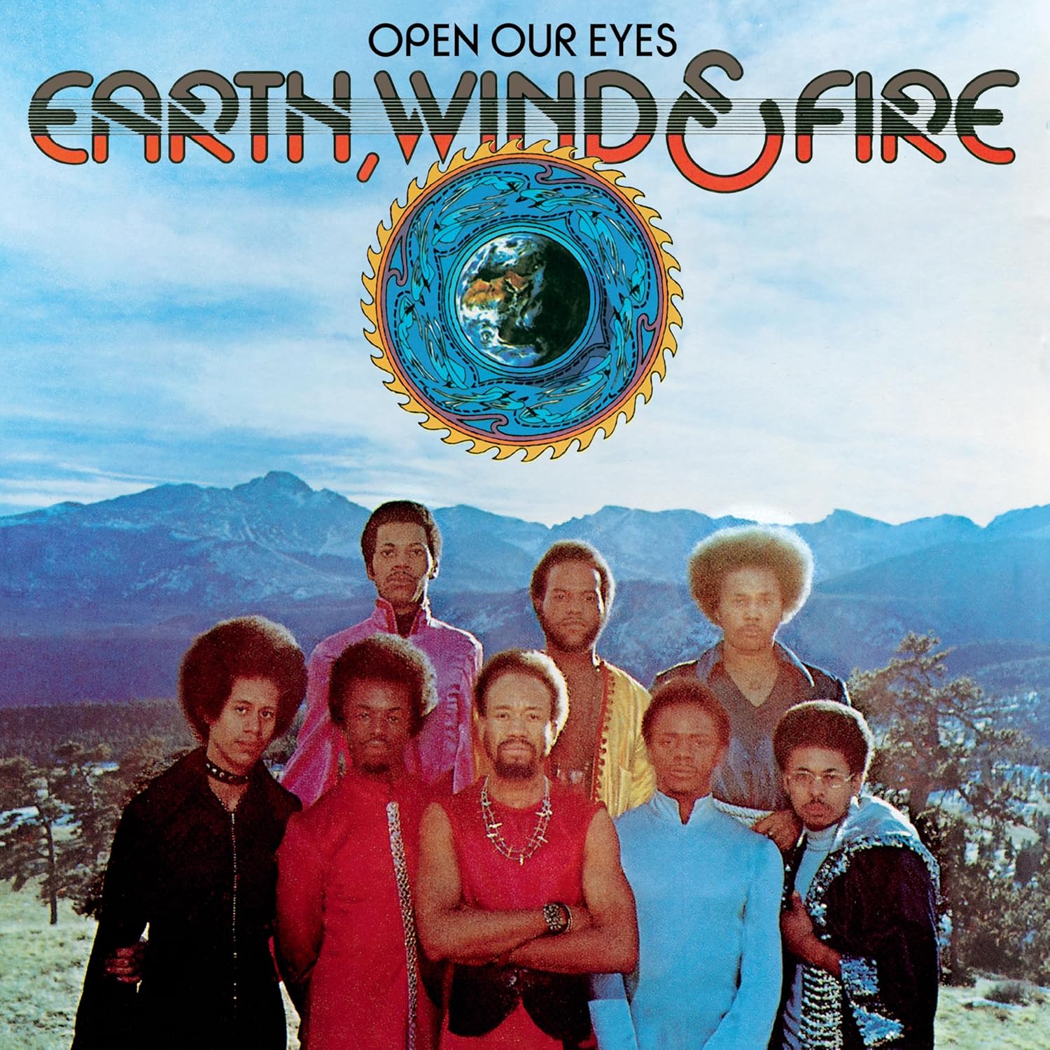 Earth, Wind & Fire album cover with band photo and sunburst design.