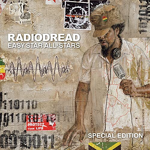 Album cover showing a man with a microphone against a textured, poster-covered wall.