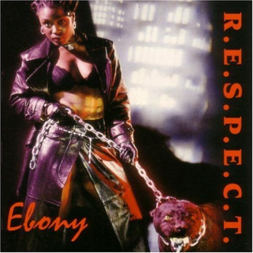 Ebony album cover: singer with a dog, purple jacket, and chain.