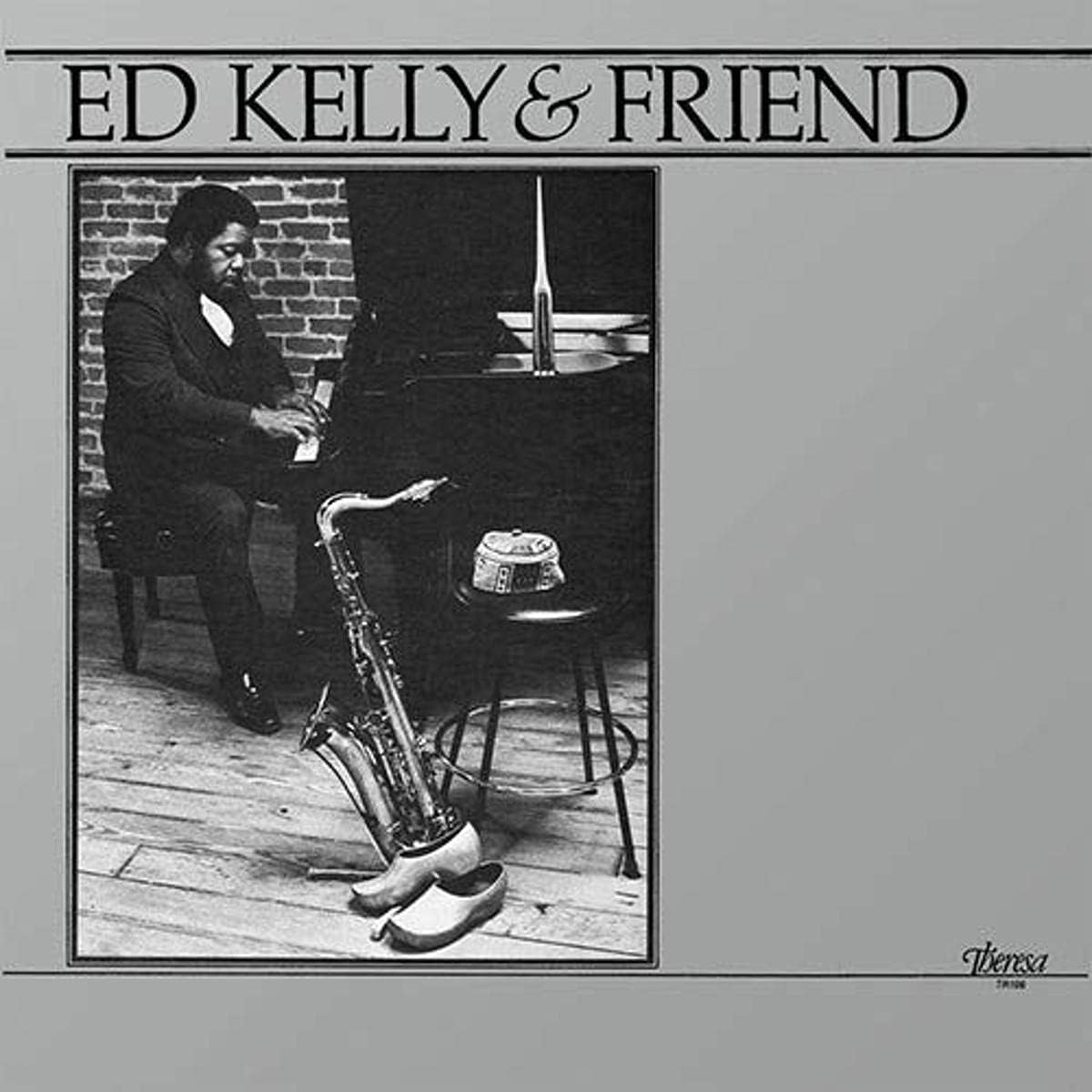 Black and white album cover featuring a jazz musician at a piano.