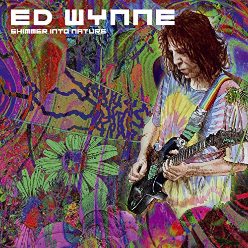 Ed Wynne with guitar, colorful psychedelic floral and abstract background.