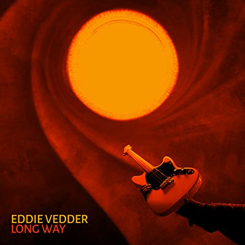 Eddie Vedder album cover featuring a guitar silhouetted against a fiery sun.