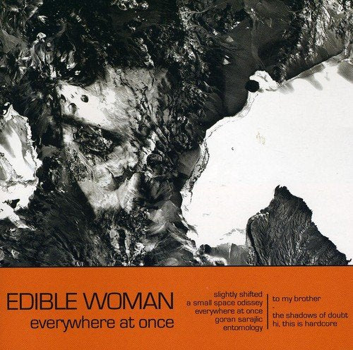CD cover: black and white abstract face with orange text below.