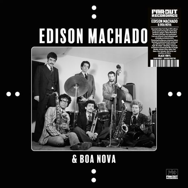 Black and white photo of a jazz band posing with instruments on a record cover.