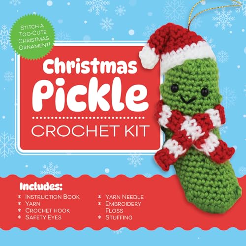 Crocheted green pickle ornament wearing a red and white Santa hat and scarf.