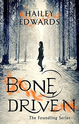 Book cover: woman in a forest, title “Bone Driven” in orange script.