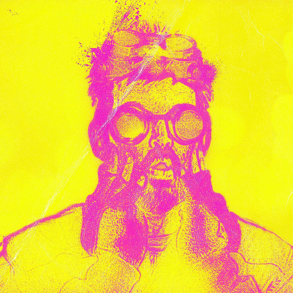 Yellow and pink portrait of a bearded man with goggles.