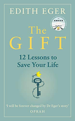 Book cover: "The Gift" by Edith Eger, with a key and floral design.