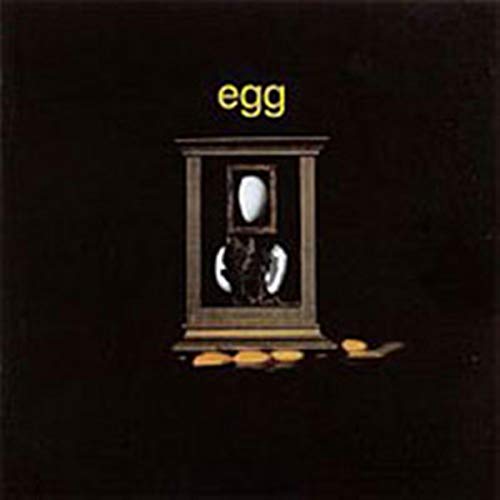 Dark album cover with a framed egg and scattered broken shells.