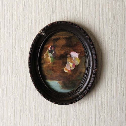 Oval vinyl record cover with a painted, vintage-style floral image.