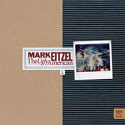 Brown and black album cover with Polaroid photo and red and blue text.