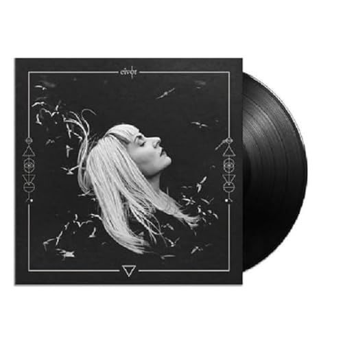 Black vinyl record with album cover featuring a woman’s face in silhouette.