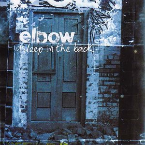 Album cover featuring a blue-toned image of a wooden door in a brick wall.