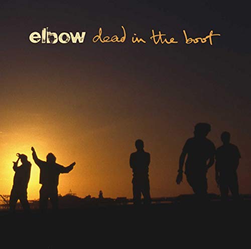 Silhouettes of five people standing against a sunset sky with band and album text.