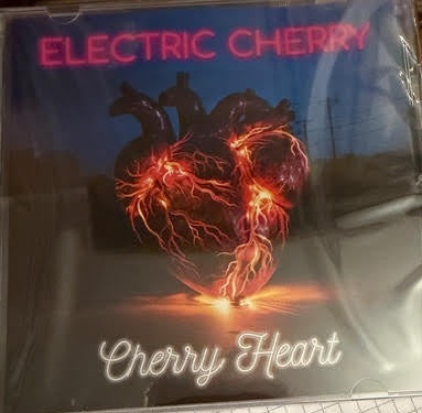 CD cover: glowing red heart with lightning against a blue sky.
