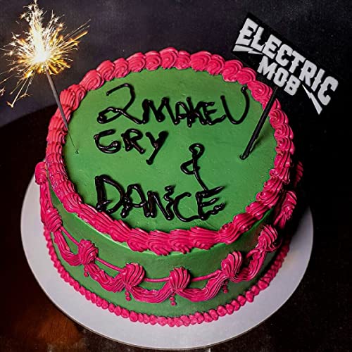 Green frosted cake with “Electric Mob - 2 Make U Cry & Dance” written on it.