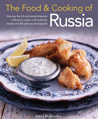 Cookbook cover featuring fried fish, lemon wedges, and tartar sauce on a plate.