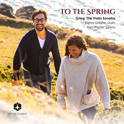 CD cover featuring two smiling people walking in a field.