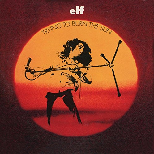 "CD album cover featuring a silhouette of a man playing violin against an orange sun."