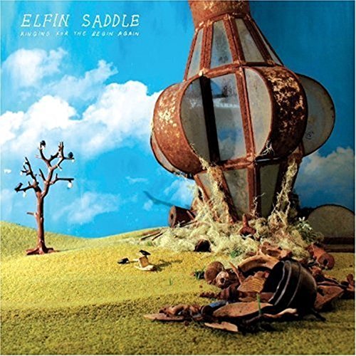 Album cover: a rusty, large structure on a green, rolling hill.