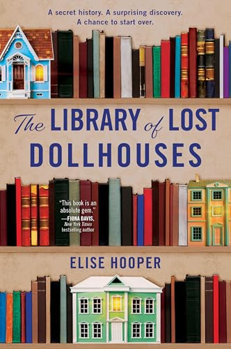 Book cover featuring dollhouses and stacked books, titled “The Library of Lost Dollhouses.”