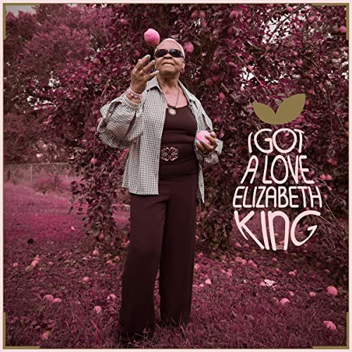 Elizabeth King album cover: woman with apples in an orchard.