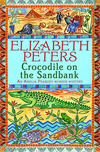 Book cover illustration featuring an Egyptian desert scene, a green crocodile, and patterned borders.