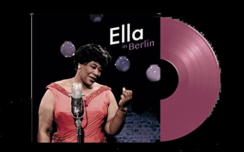 Ella Fitzgerald singing into a microphone next to a pink vinyl record.