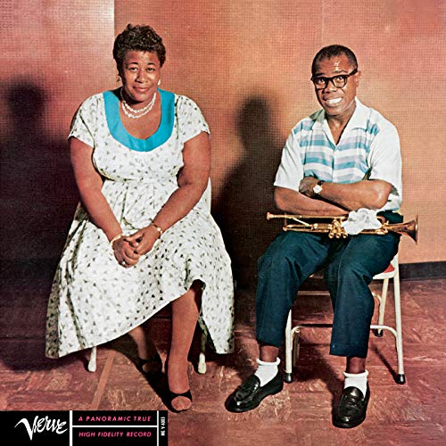 Ella Fitzgerald and Louis Armstrong sitting together, with Louis holding a trumpet.