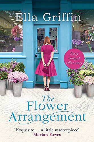 Book cover featuring a woman in pink standing outside a flower shop.