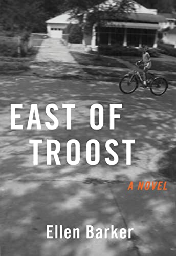 Book cover: "East of Troost" with a black and white neighborhood scene.