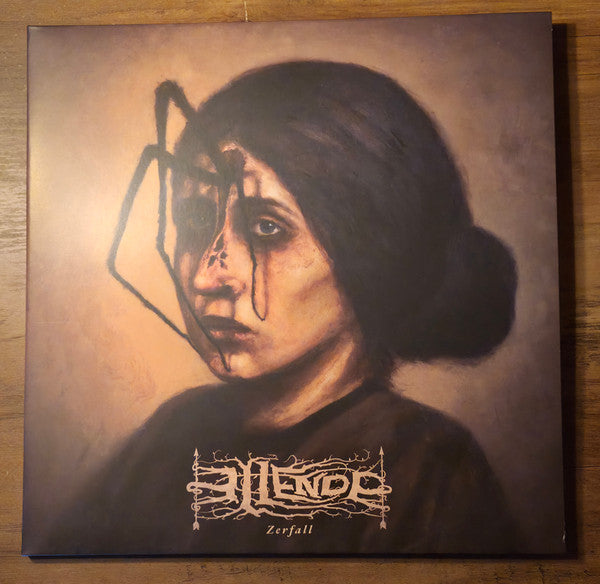 Vinyl record cover with painted portrait of a woman with tears.
