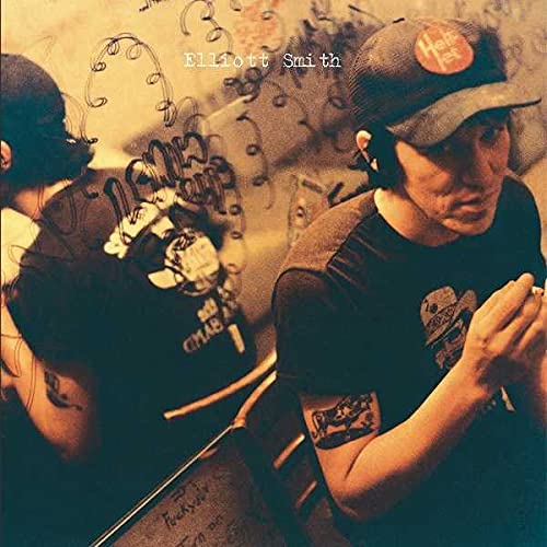 Elliott Smith album cover: two figures with tattoos, sepia tone.