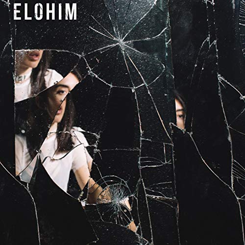 Woman’s reflection fractured in a cracked mirror, album cover for Elohim.