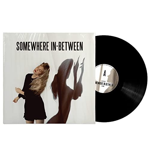 Vinyl record of Eloise’s “Somewhere In-between” with cover art of a woman.