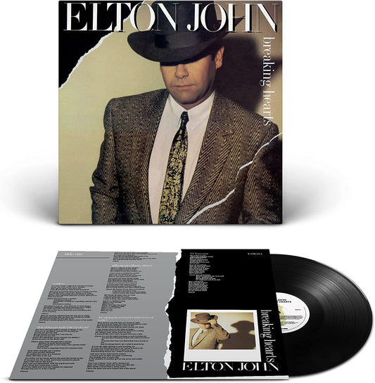 "Elton John album cover featuring a man in a suit and hat."