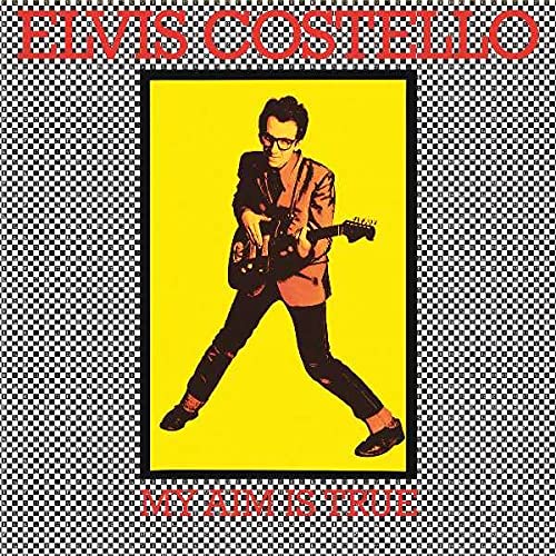 Album cover for Elvis Costello’s “My Aim Is True” featuring a guitarist.