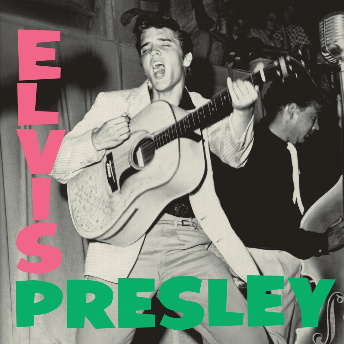 Elvis Presley singing and playing acoustic guitar with large pink and green text overlay.