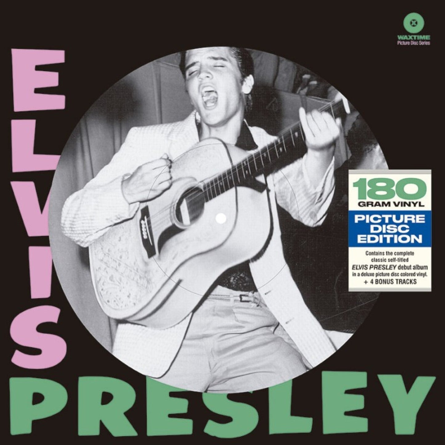Elvis Presley album cover featuring a black and white photo of him with a guitar.