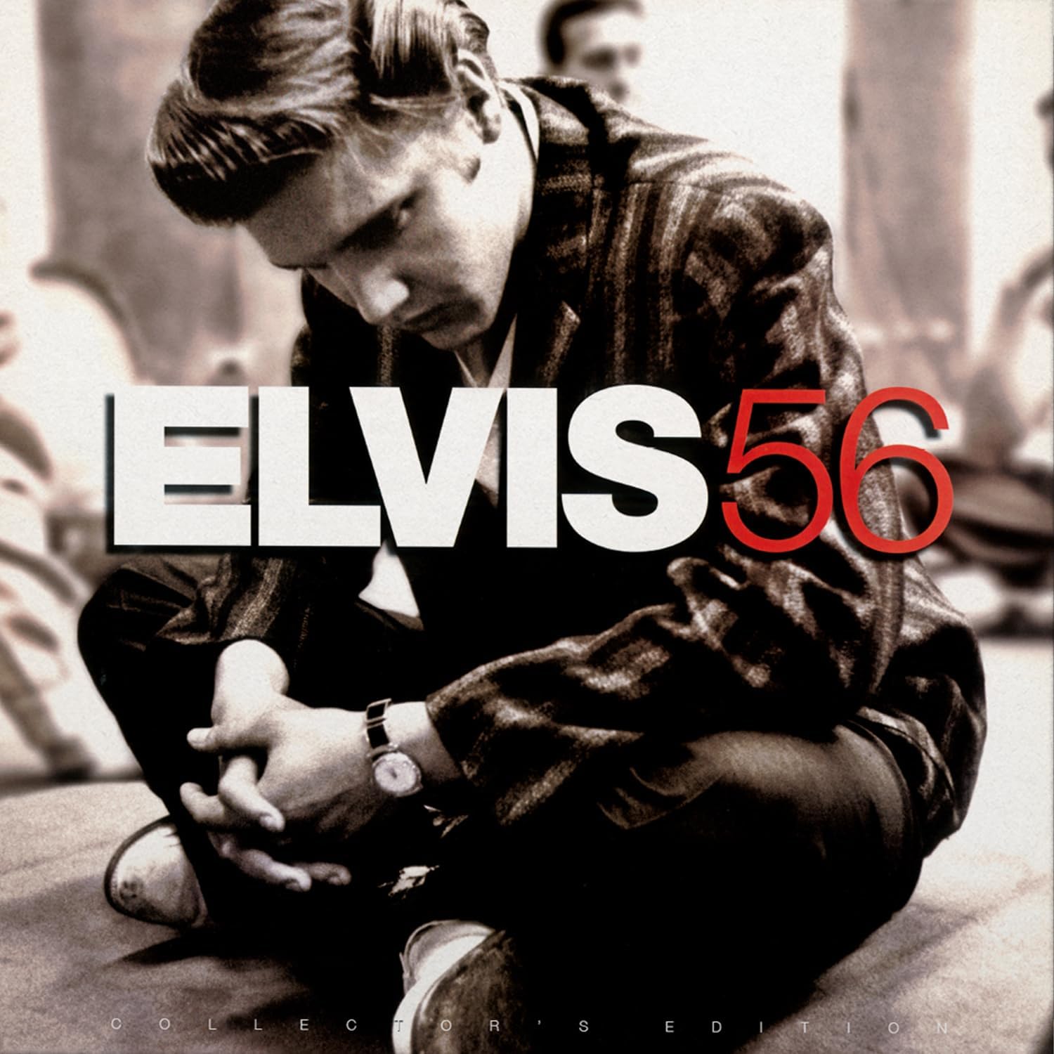 Elvis Presley album cover, "Elvis 56," featuring a seated young Elvis.