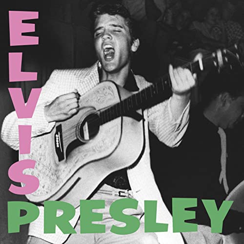 BlackSSLBlack and white photo of ElvisCHC-Elvis Presley singing andH-while playing an acoustic guitar.
