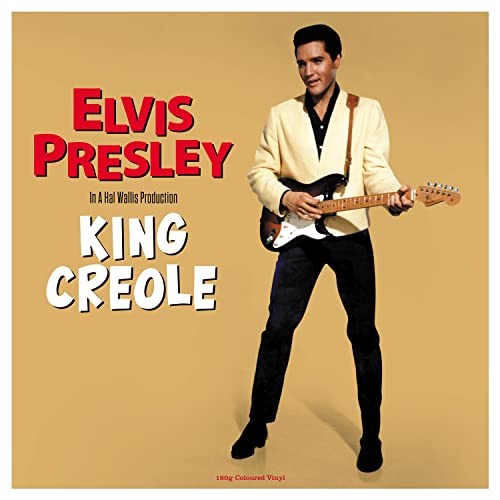Elvis Presley album cover for "King Creole" featuring him with a guitar.
