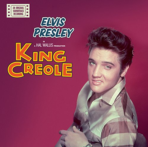 "Elvis Presley album cover featuring a portrait of Elvis against a red background."