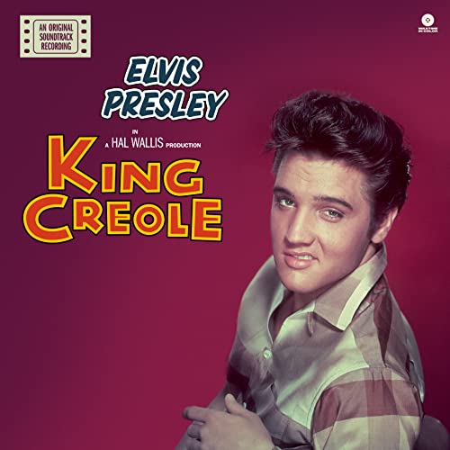 Elvis Presley on the King Creole soundtrack album cover against a dark red background.