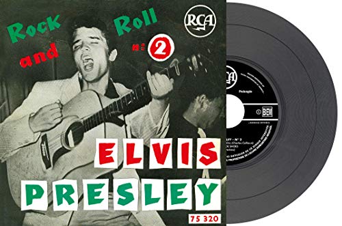 Elvis Presley vinyl record cover with image of him playing guitar.