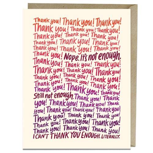 Close-up of a cream card covered in repeating, colorful "Thank you!" text.