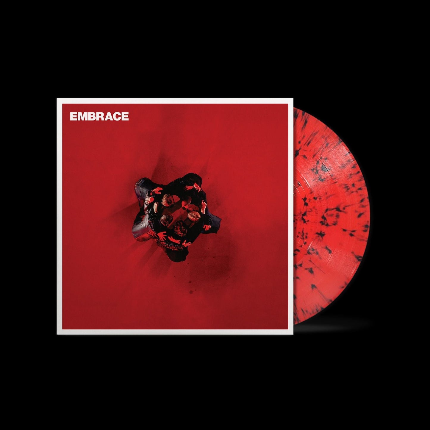 Vinyl record cover and red and black marbled disc on a black background.