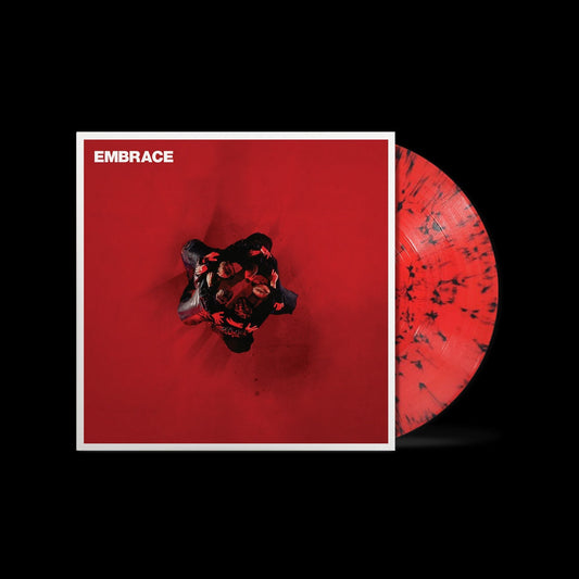 Vinyl record cover and red and black marbled disc on a black background.