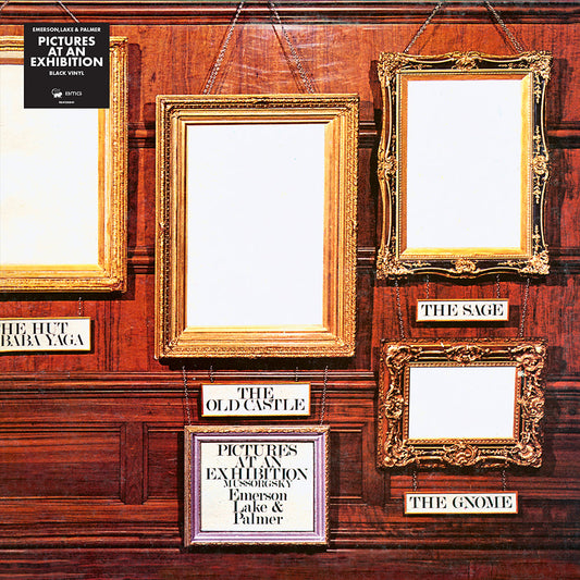 Four empty gold picture frames with labels on a dark wood paneled wall.